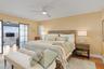 Master bedroom with translucent glass barn doors