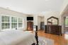 Primary bedroom with 2 walk-in closets