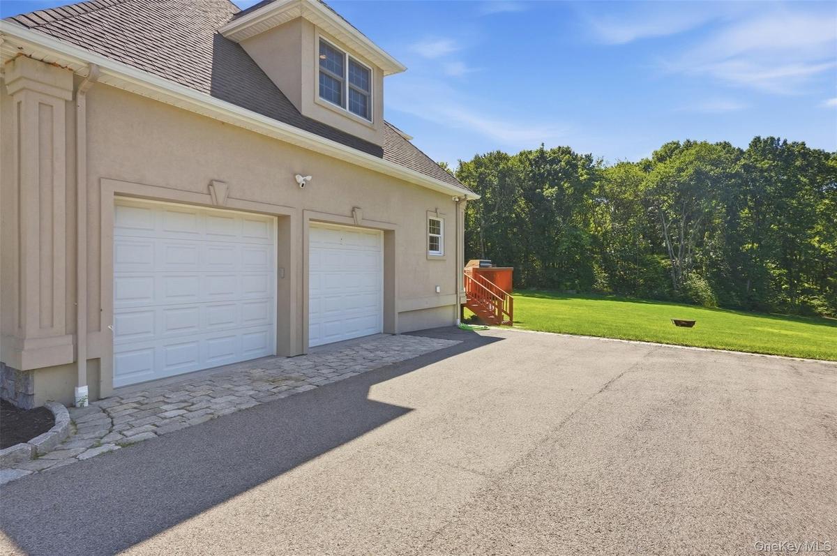 2-car garage with tall ceilings