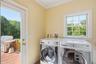 Laundry room with deck and garage access