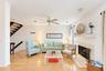 living room with wood burning fireplace