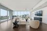 City view from kitchen overlooking living space. Dynamic layering of DTO buildings.
