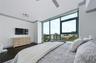 Primary bedroom, with en suite. City facing view.