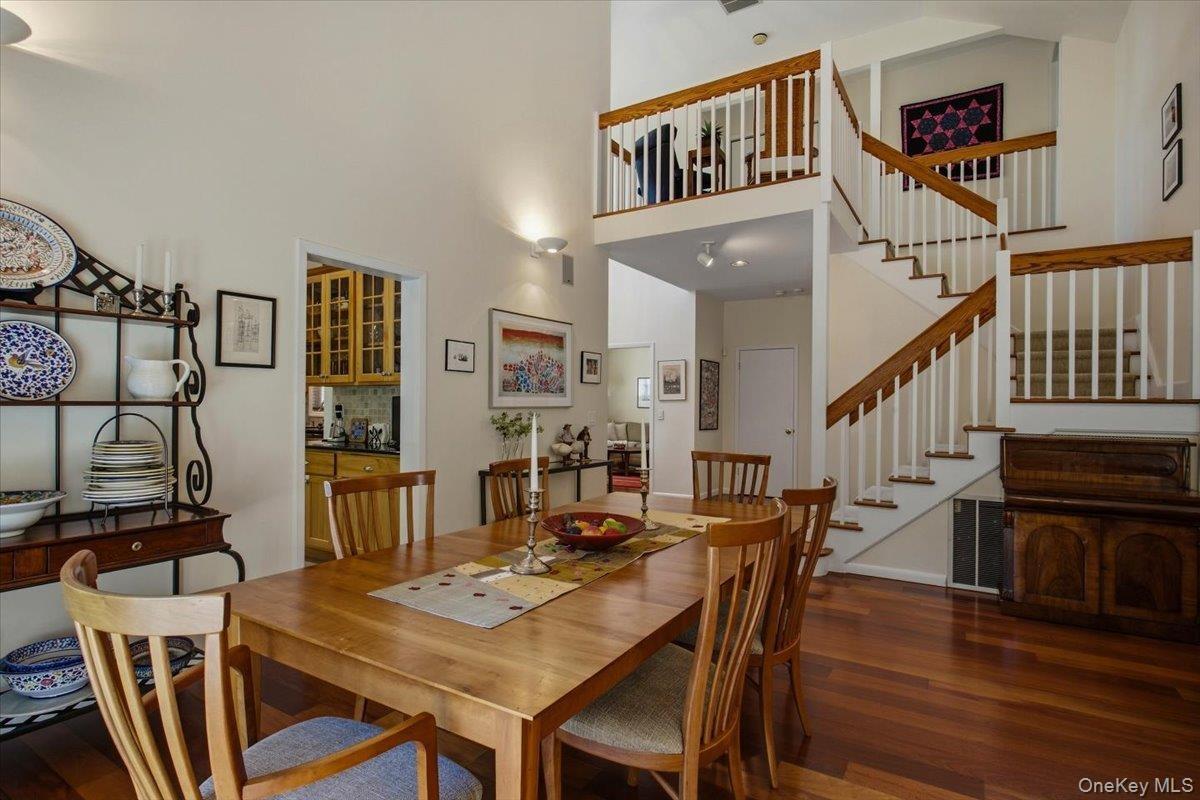 A dramatic first impression is created by the vaulted ceilings and open floor plan, which give the home a spacious and inviting feel.
