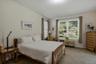 The first-floor primary bedroom suite features a spacious walk-in closet