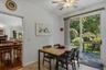 Eat-in kitchen with sliding glass door to deck and yard.