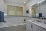 In addition, the primary bathroom offers a brand new tub offering comfortable and functional layout.