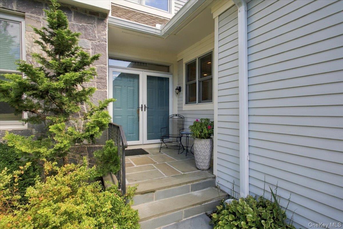 A welcoming double door entrance from the front porch.