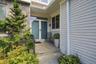 A welcoming double door entrance from the front porch.