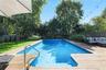 View of pool with a fenced backyard, an outdoor hangout area, and a patio area