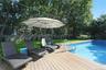 View of swimming pool with a fenced backyard and a deck