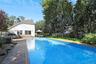 View of pool featuring a fenced backyard, a patio area, and outdoor dining area