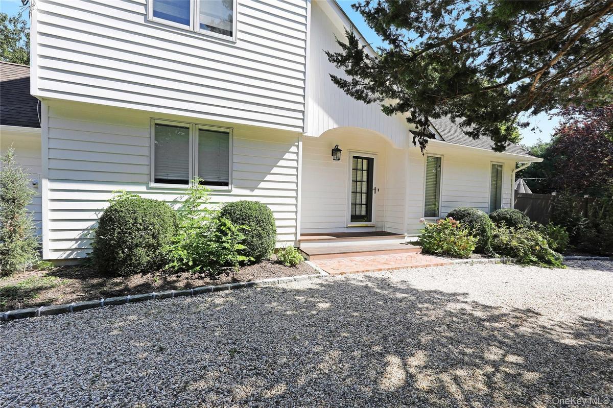 Property entrance with a shingled roof