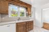 kitchen with door out to patio and yard