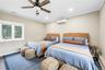 Bedroom featuring crown molding, ceiling fan, recessed lighting, and a wall unit AC