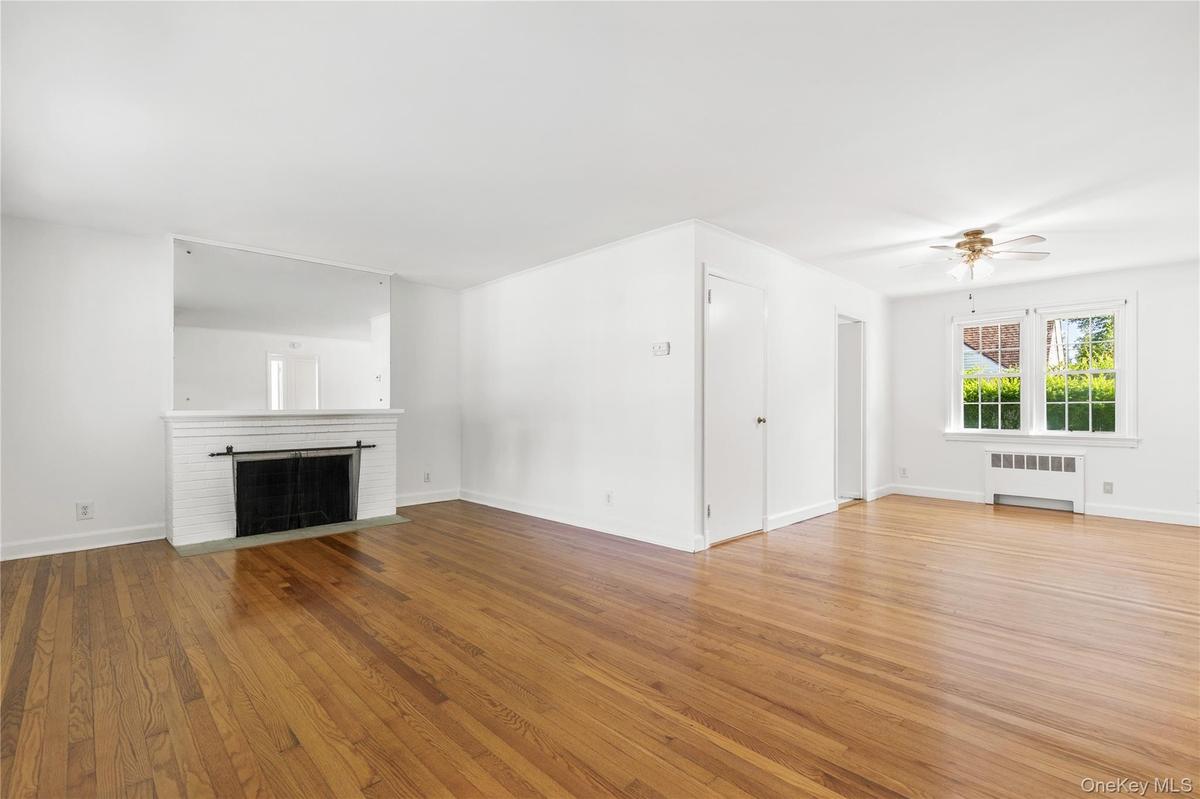 living room with fpl and dining area