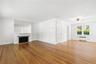living room with fpl and dining area