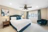 Bedroom with carpet floors, ceiling fan, and recessed lighting
