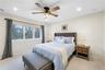 Bedroom featuring light colored carpet, recessed lighting, and a ceiling fan