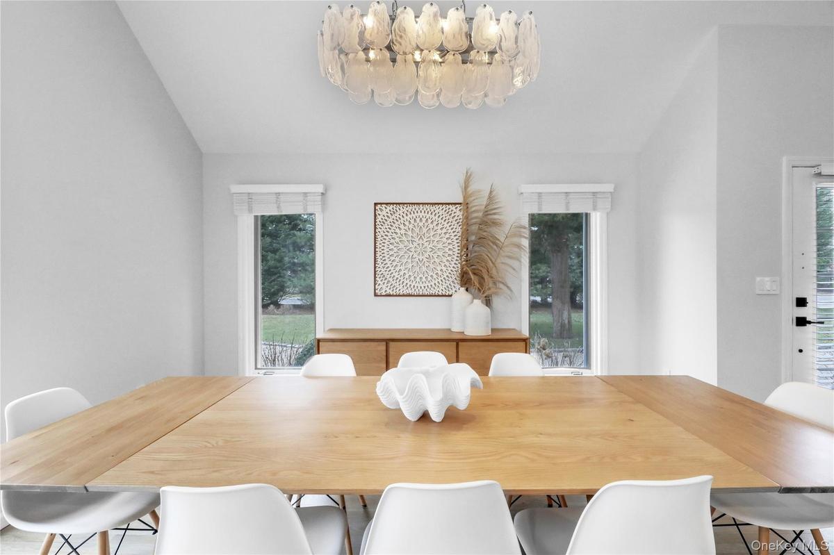 Dining space featuring healthy amount of natural light and lofted ceiling