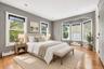 **Virtually Staged** Hardwood flooring, recessed lighting, and a multi-window bay feature