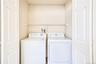 Second floor laundry area virtually decluttered