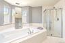 Alternate view of sun filled primary bathroom