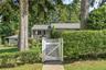 Private, level grounds surround the home