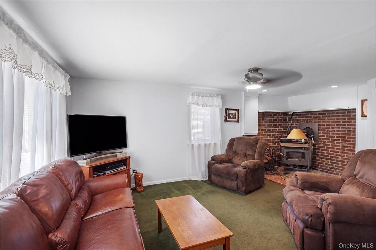Converted garage, den with wood burning stove