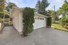 A generous driveway leads to the garage