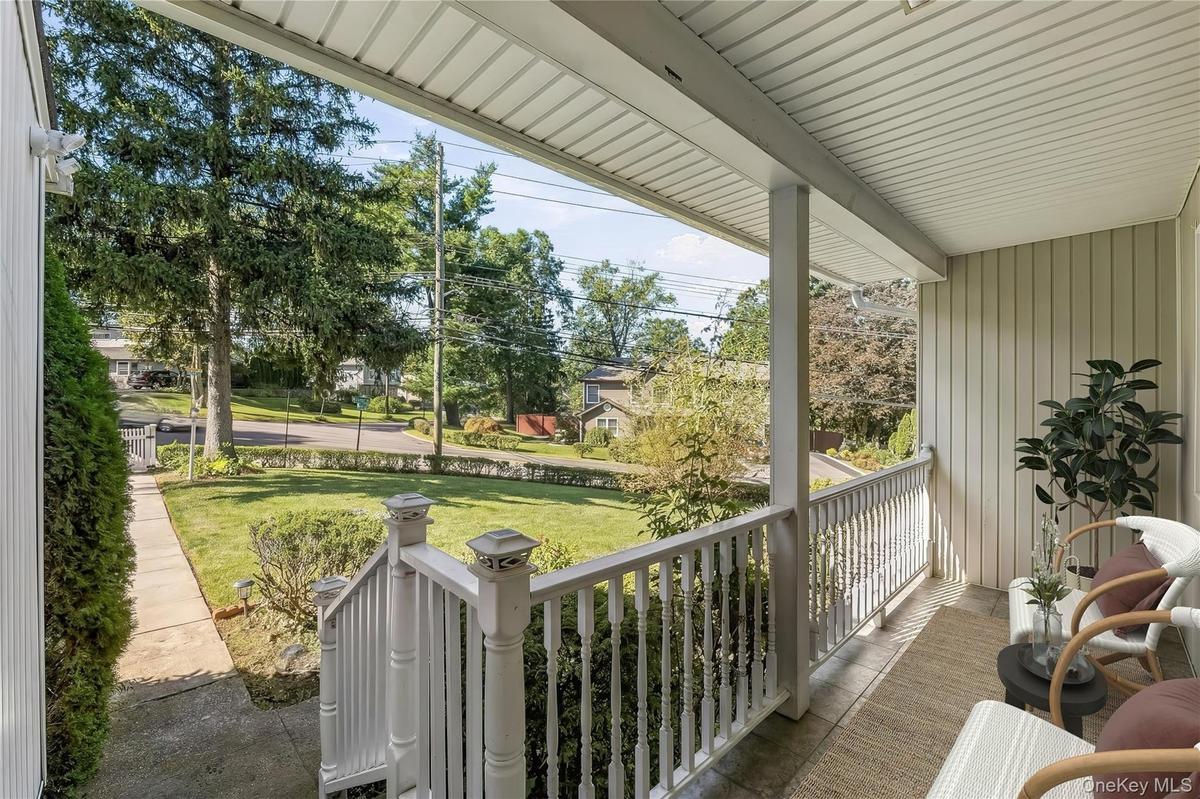 Enclosed Front Porch, a welcoming presence.