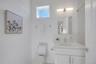 Third full bathroom  conveniently located in the hallway outside the third bedroom.