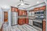 Updated EIK with SS Appliances, Gas Cooking, Large Dining Area, Sliders to Sunroom