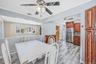 Updated EIK with SS Appliances, Gas Cooking, Large Dining Area, Sliders to Sunroom