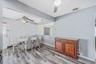 Updated EIK with SS Appliances, Gas Cooking, Large Dining Area, Sliders to Sunroom