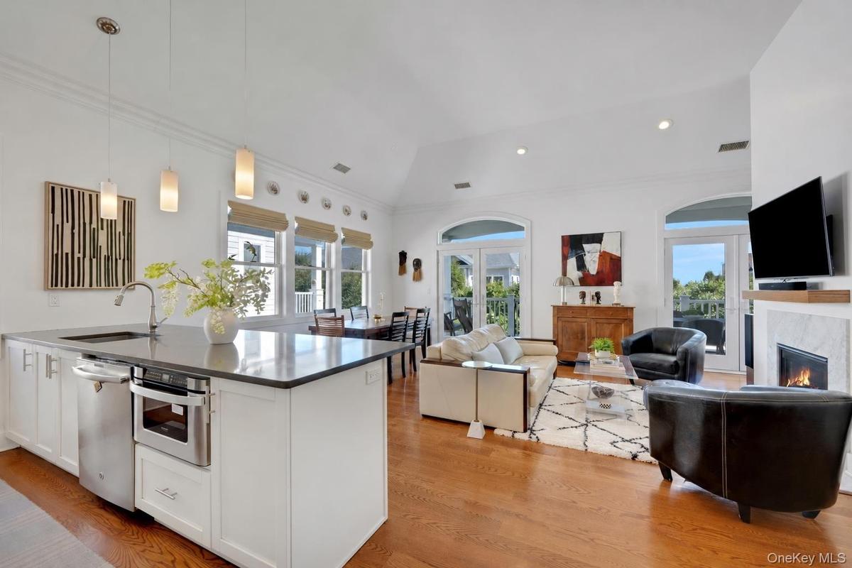 Soaring 15 ft cathedral ceilings and open floor plan. Double French Doors leading outside.