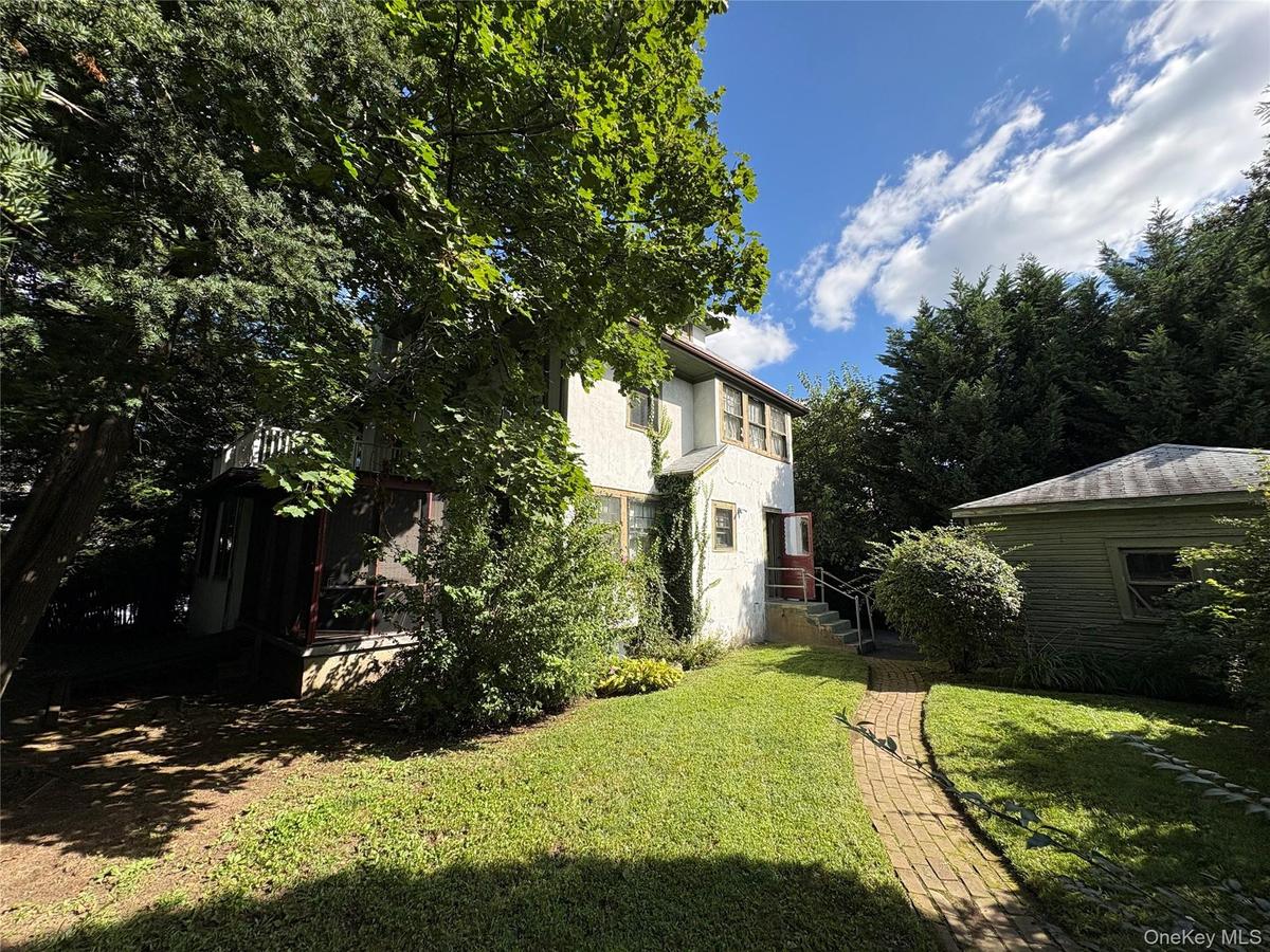 Back of home, brick walkway, South facing.