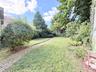 Back Yard, lawn, bushes and brick path