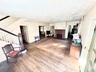 Large 24 X 20 Living room with hard wood floors and wood burning fireplace.