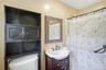 Primary bath featuring stand in shower