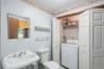 Half bath and laundry room in lower level