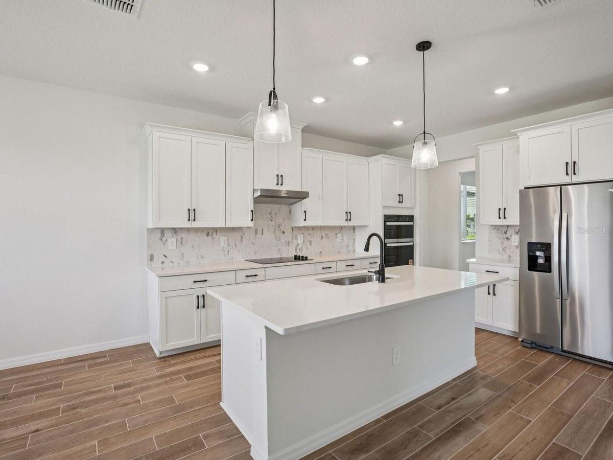Photo is not of the actual home, but is an inspirational photo of builder’s model home and may depict options, furnishings, and/or decorator features 