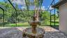 Side screen pool area with fountain.