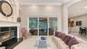 Separate Living Room with decorative natural gas fireplace.