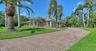 Long paver driveway with the side entry two-car garage.