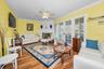 Separate family room with a fireplace and lanai entrance