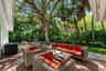 Large shade side-yard wiith new raised deck perfect for dining, relaxing, and outdoor recreation.