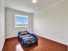 UPSTAIRS THIRD BEDROOM OVERLOOKING POOL AND FIELD AREA.