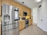 PARTIAL VIEW OF KITCHEN WITH LARGE PANTRY