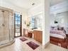 PARTIAL VIEW OF MASTER BATHROOM WITH FRENCH DOOR LEADING TO BALCONY WHERE YOU CAN ENJOY ROMANTIC SUNSETS BEHIND CORN FIELD.